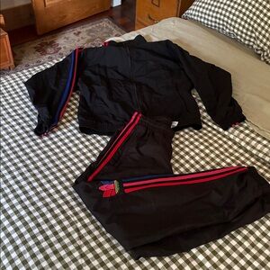 Adidas track suit with Red and Blue Accents. Size small